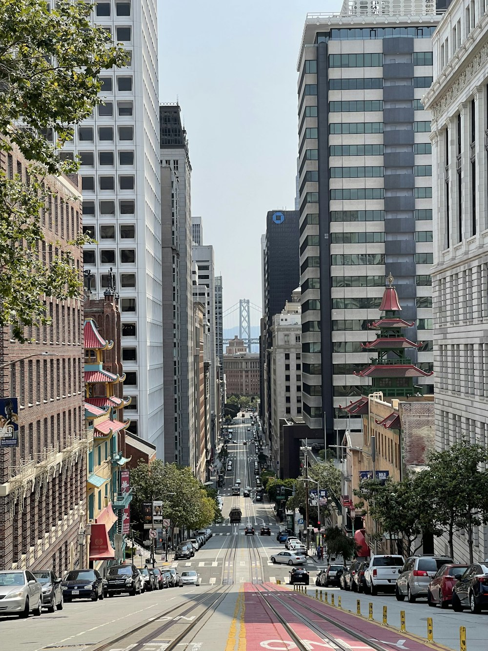 people walking on street near high rise buildings during daytime