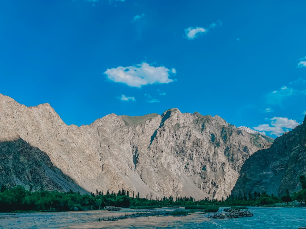 gray rocky mountain under blue sky during daytime