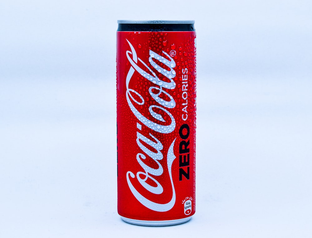 coca cola can on white surface