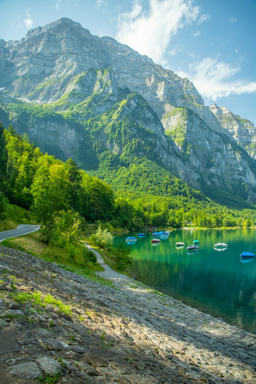 a group of boats floating on top of a lake