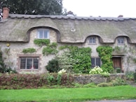 The charming exterior of the 500-year-old cottage.