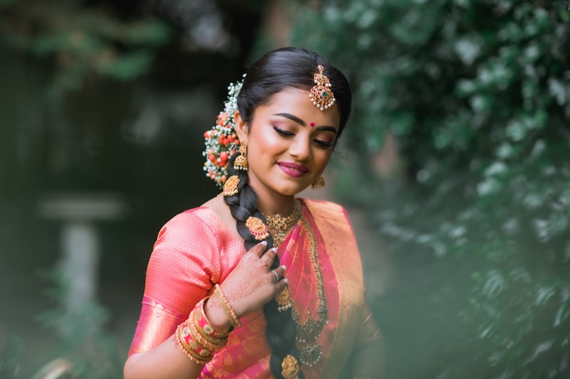 woman in pink dress wearing gold and white floral crown