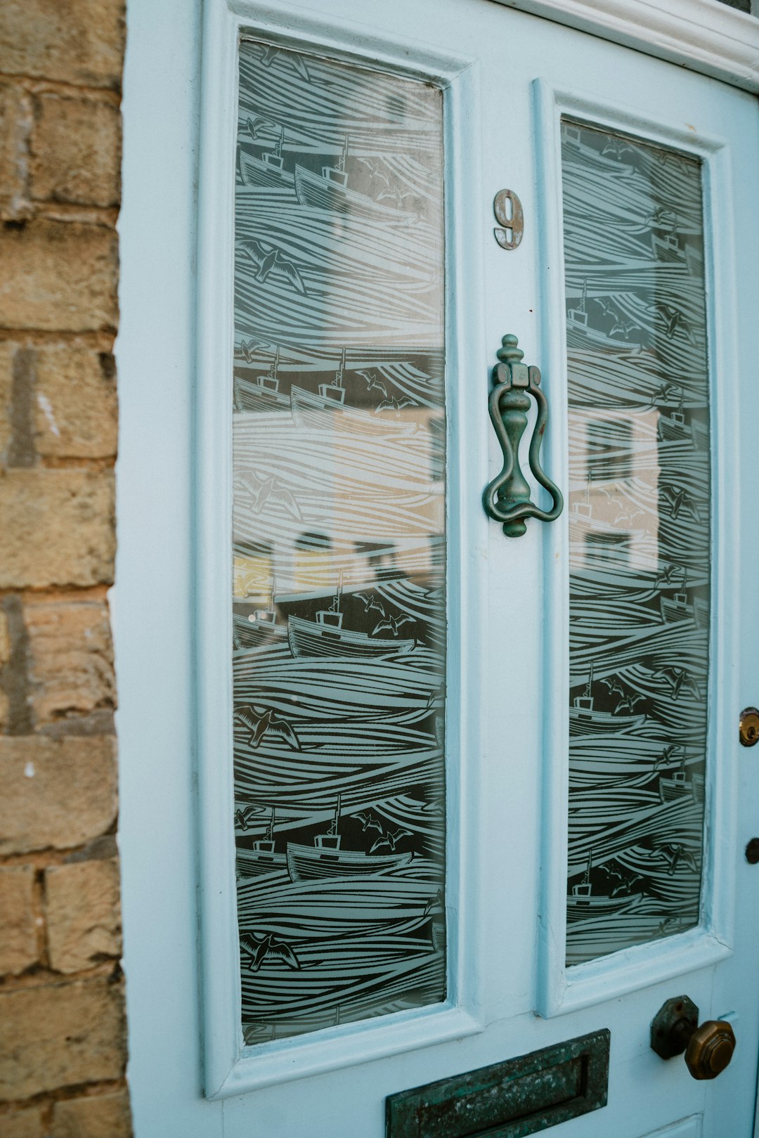 white wooden framed glass door