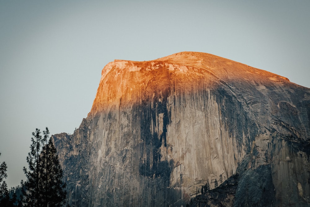 brown rocky mountain under blue sky during daytime