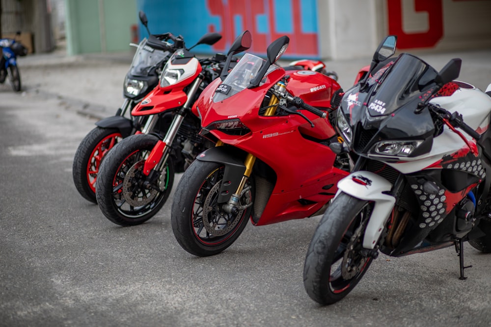 red and black sports bike on road during daytime