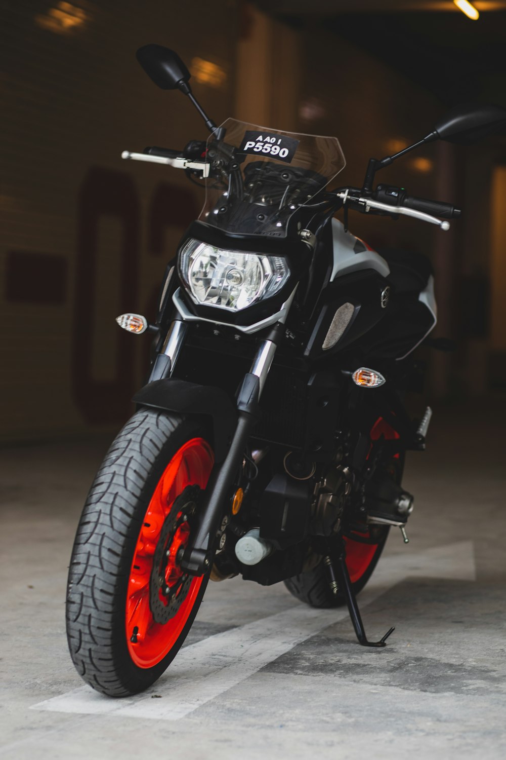 black and red motorcycle on road