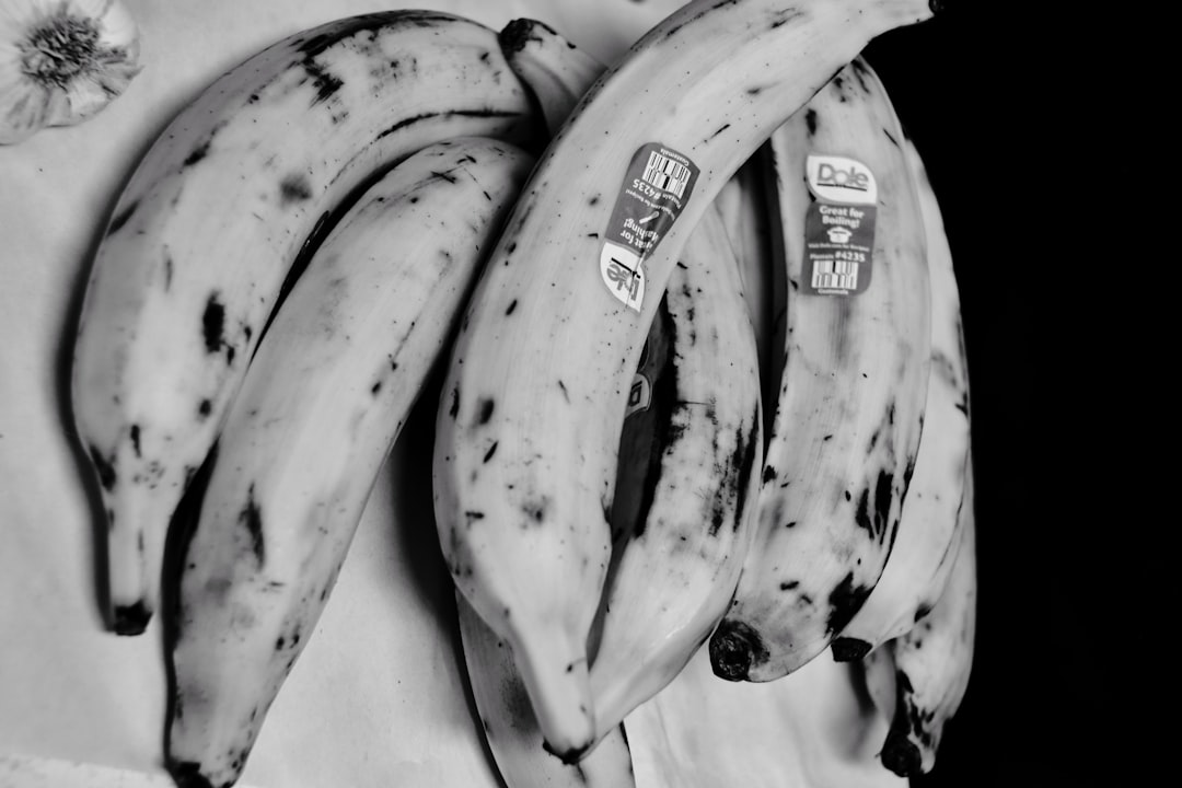 yellow banana fruit on white table