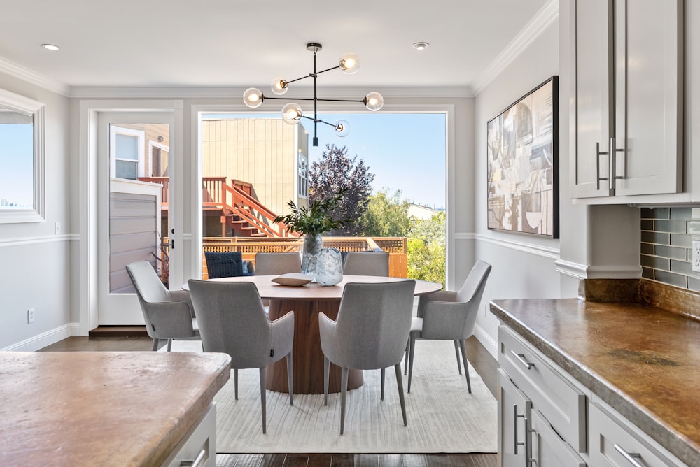 brown wooden table with chairs