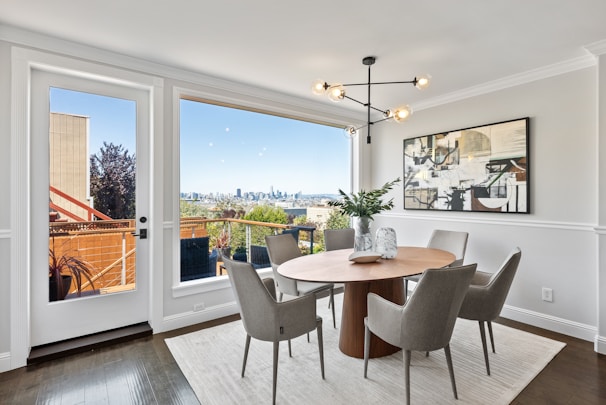 A modern dining table surrounded by chic chairs.