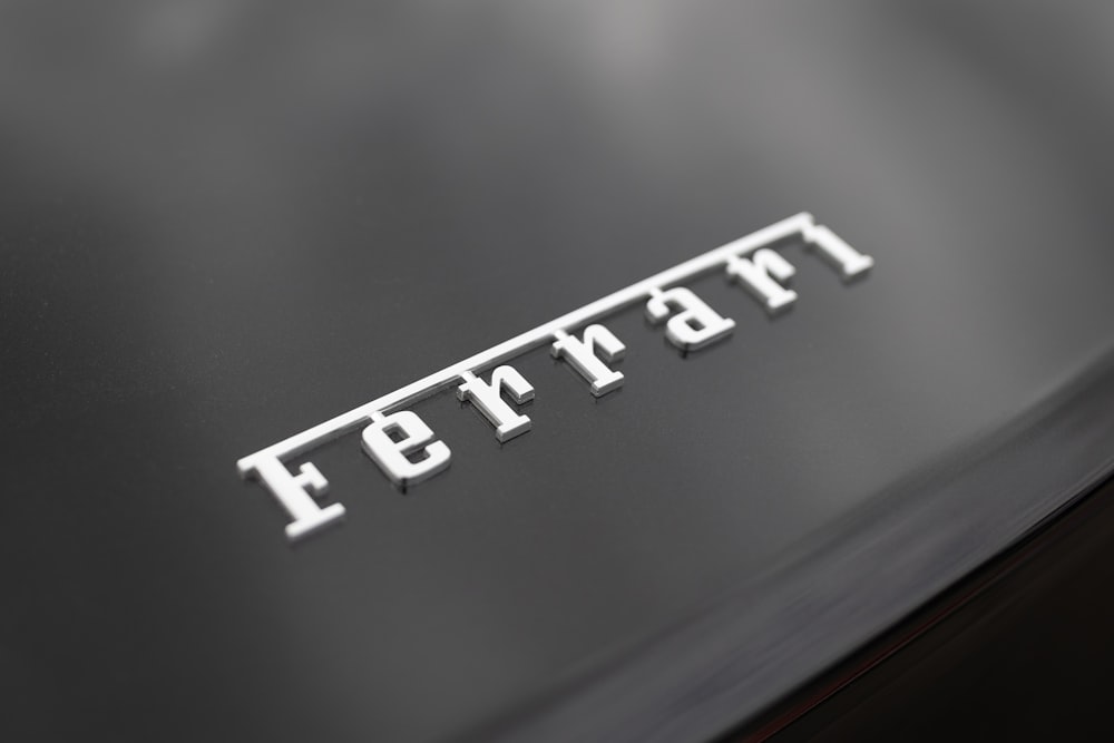 a close up of the word ferrari on a car