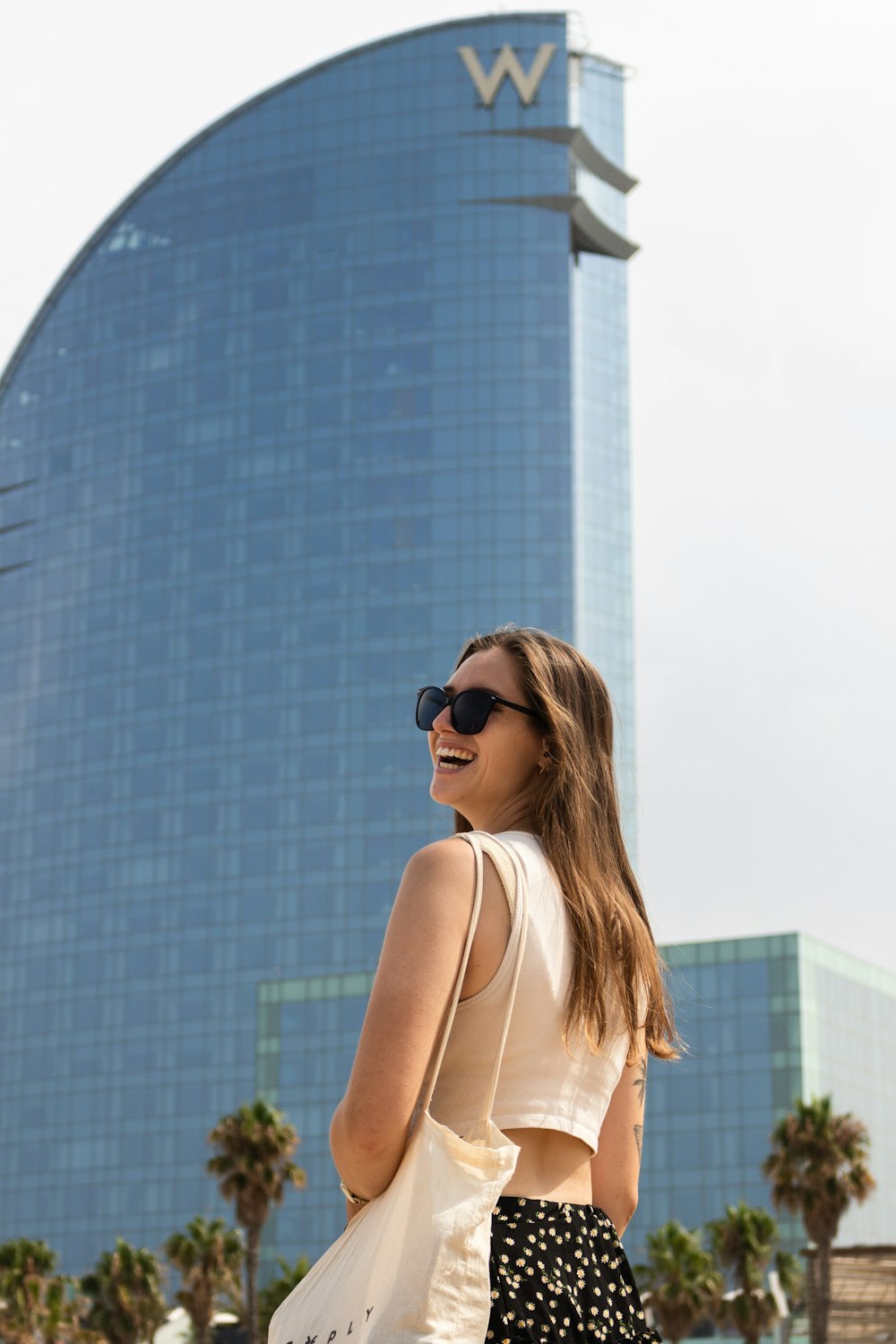 woman in white tank top wearing black sunglasses