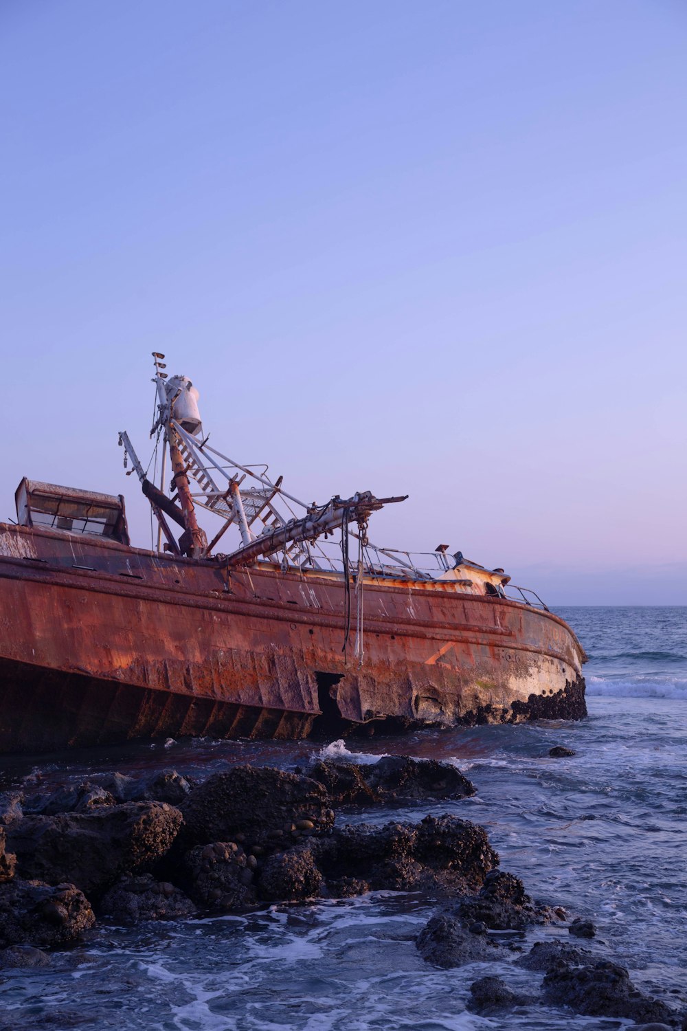 brown ship on sea during daytime