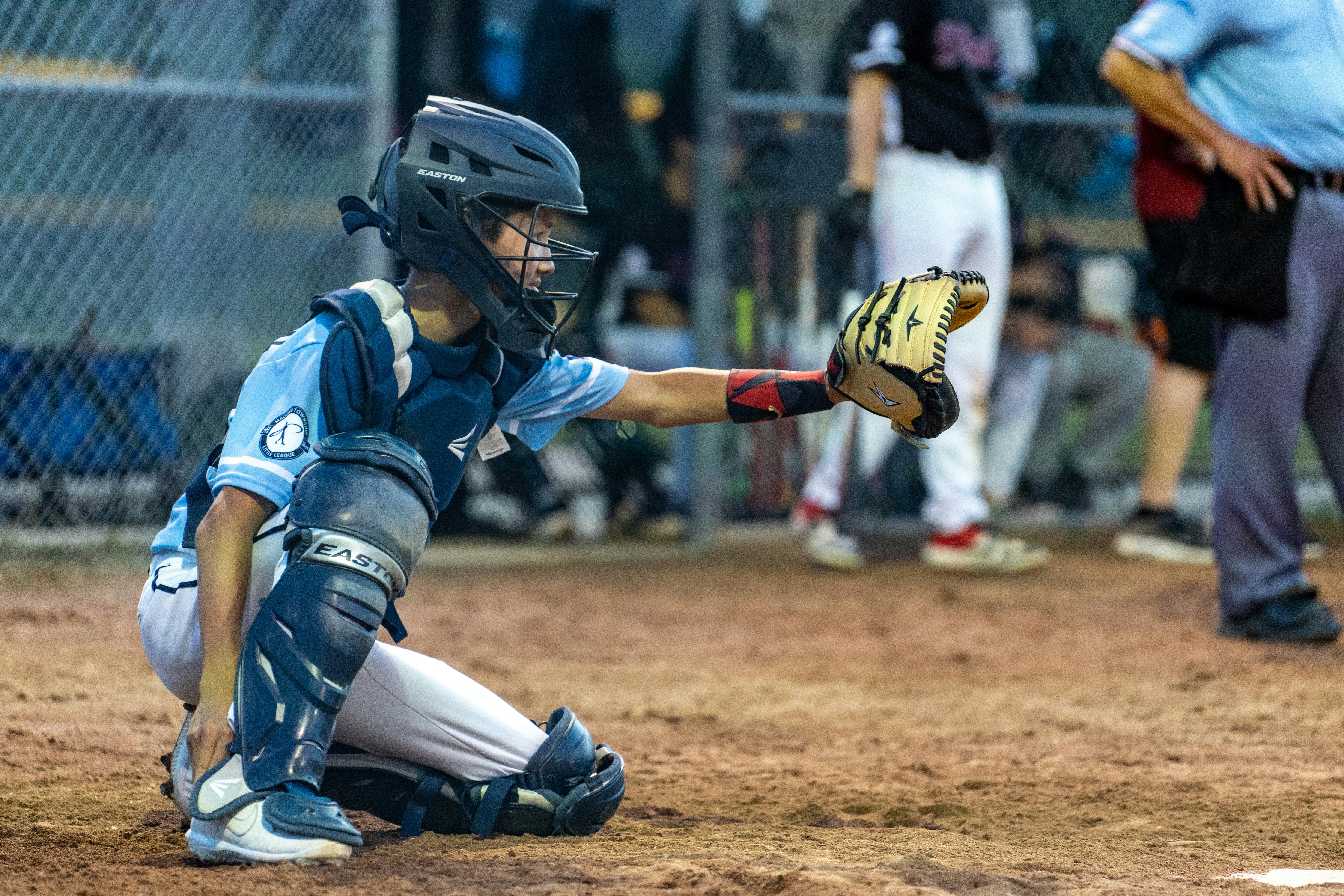 baseball catcher with catcher's mitt up