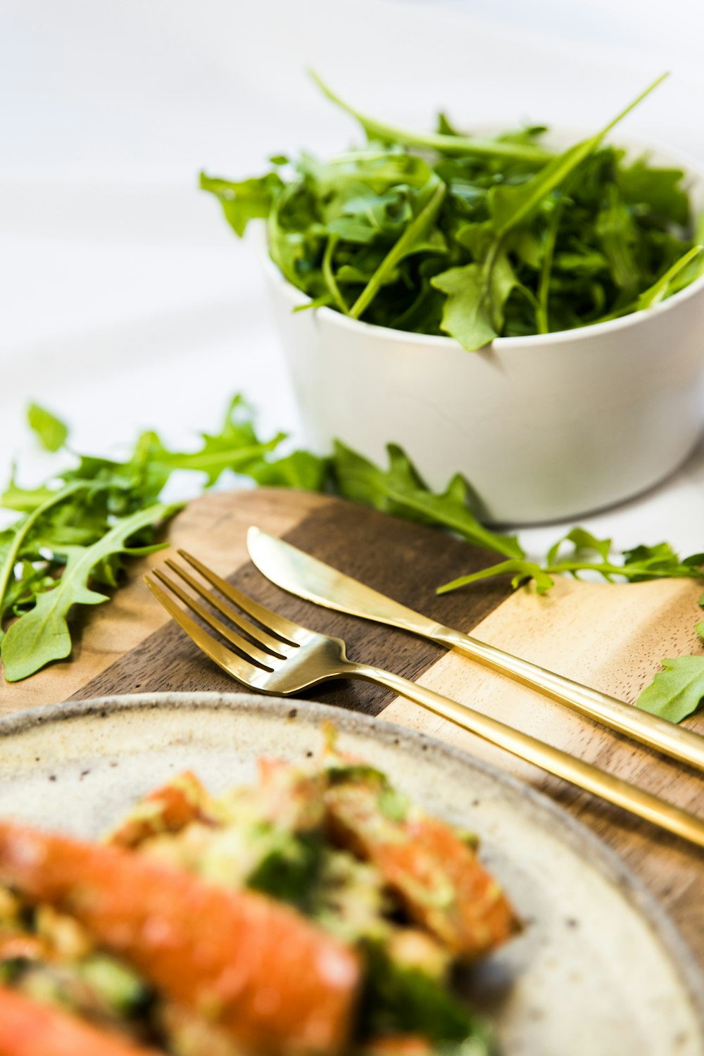 stainless steel fork beside white ceramic bowl