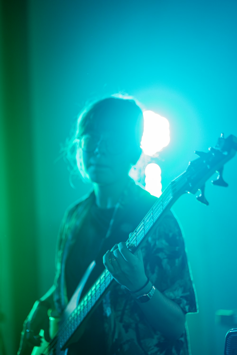 man playing guitar on stage