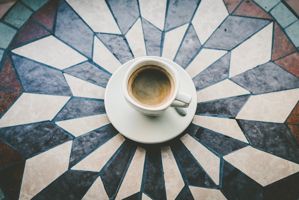 white ceramic cup on white saucer