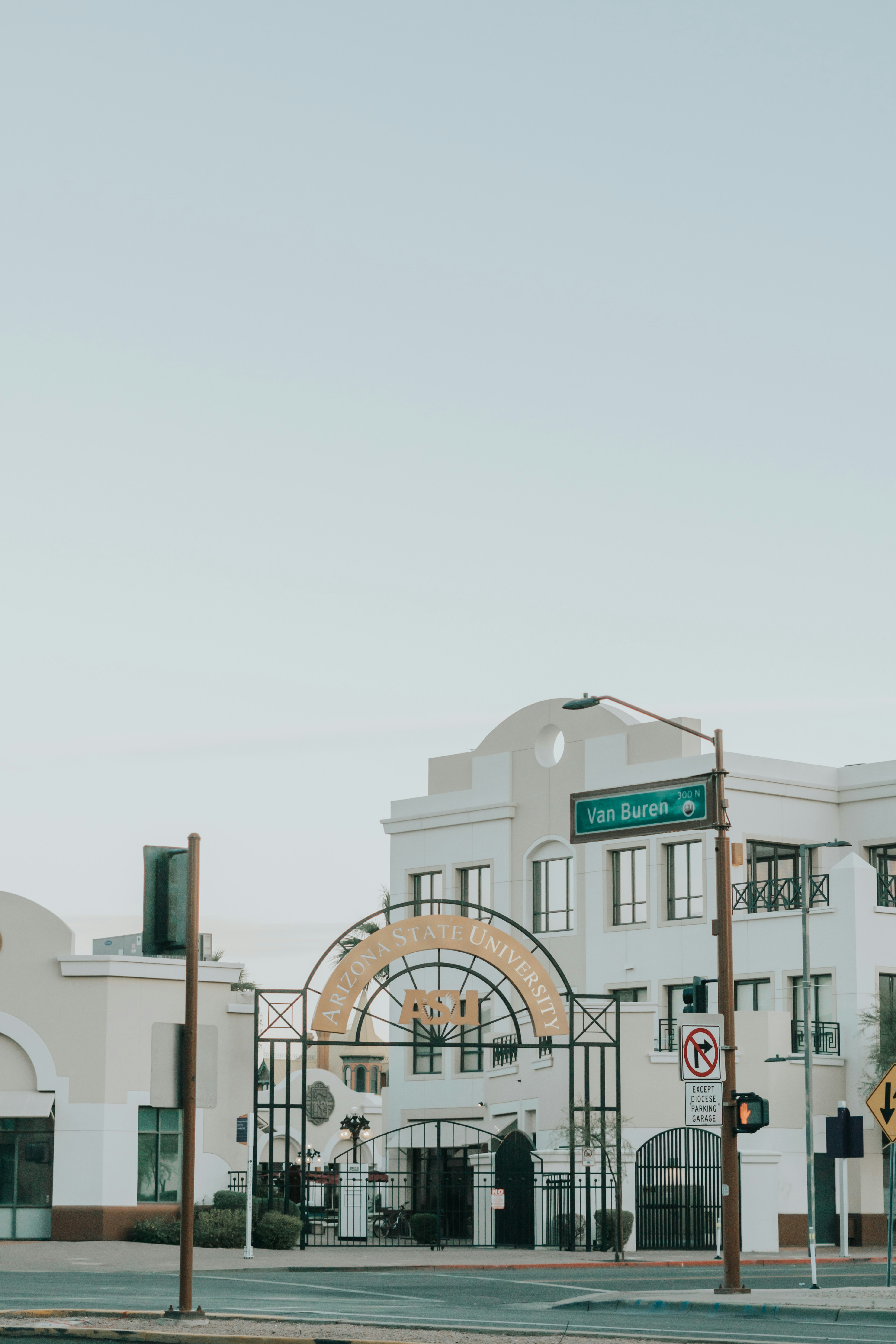 white concrete building under white sky during daytime