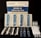 A COVID-19 Saliva Antigen Test Kit includes test cards, pipettes, swabs, and sample tubes arranged on a dark surface. The packaging is prominently displayed at the top.