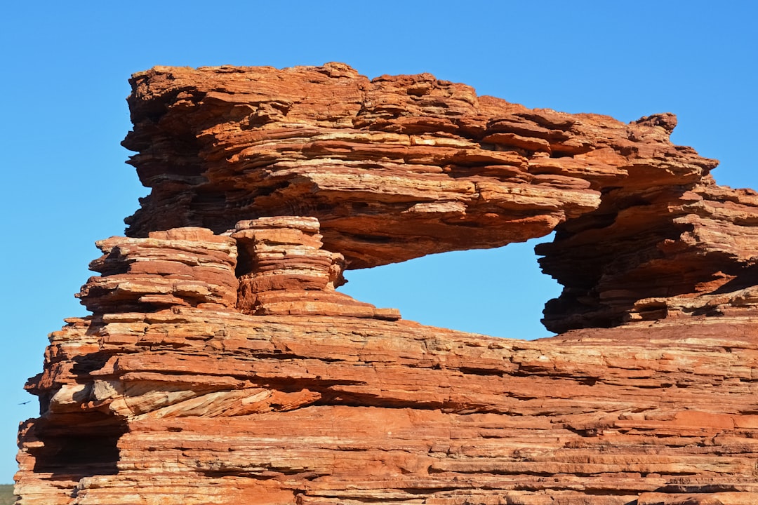 brown rock formation under blue sky during daytime