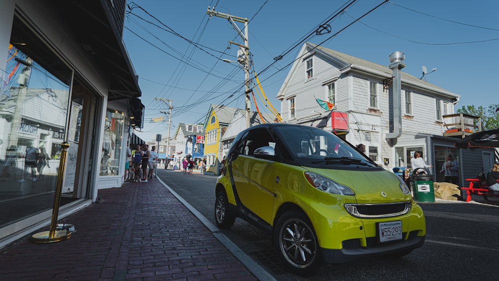 yellow car parked on sidewalk during daytime