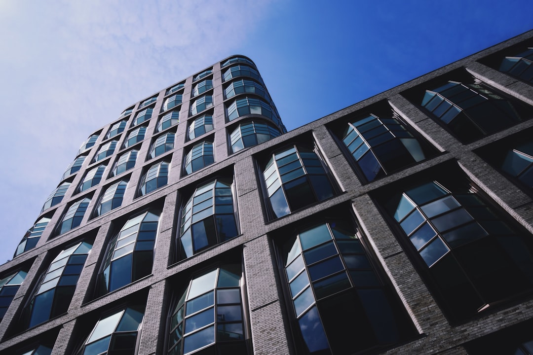 white and black concrete building under blue sky during daytime