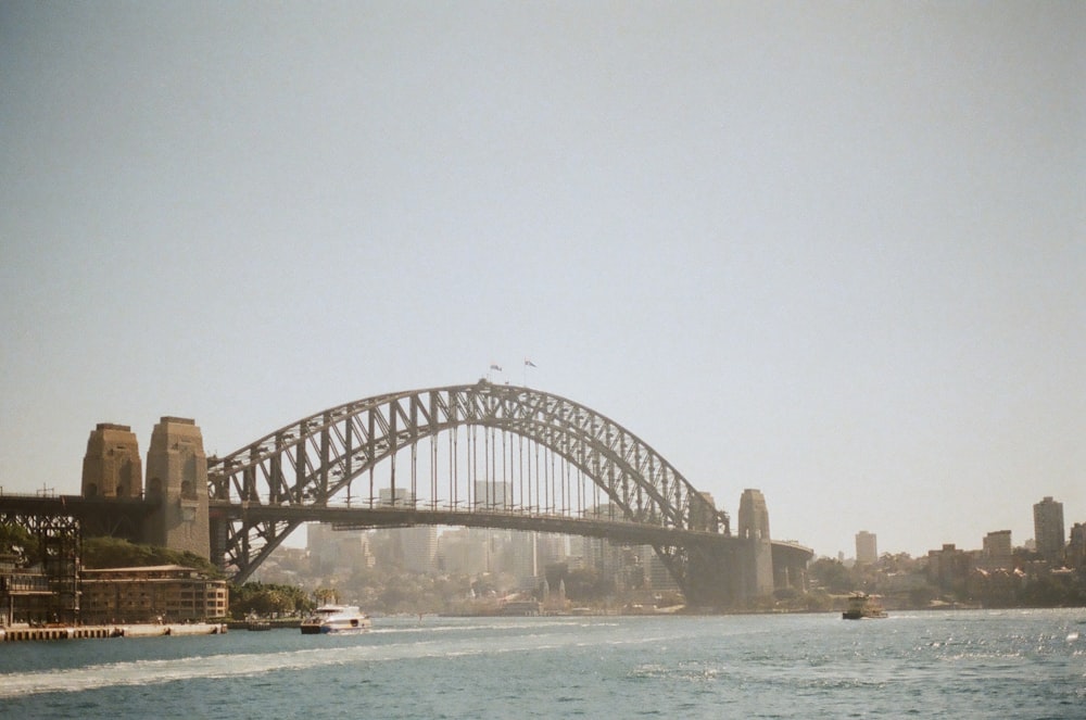 gray bridge over body of water during daytime