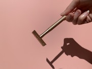 person holding gray metal tool