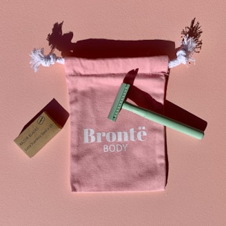 green and white textile on brown wooden table