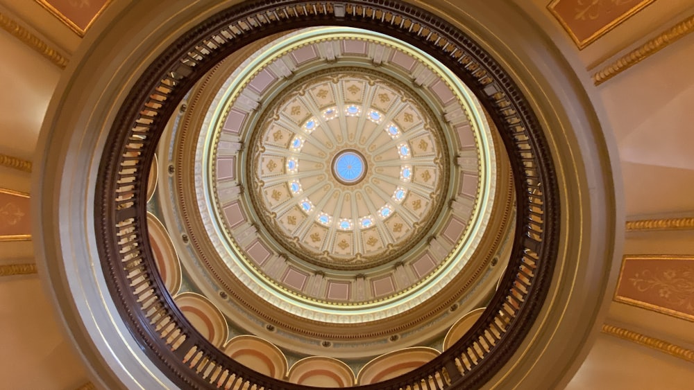 low angle photography of brown and beige dome ceiling