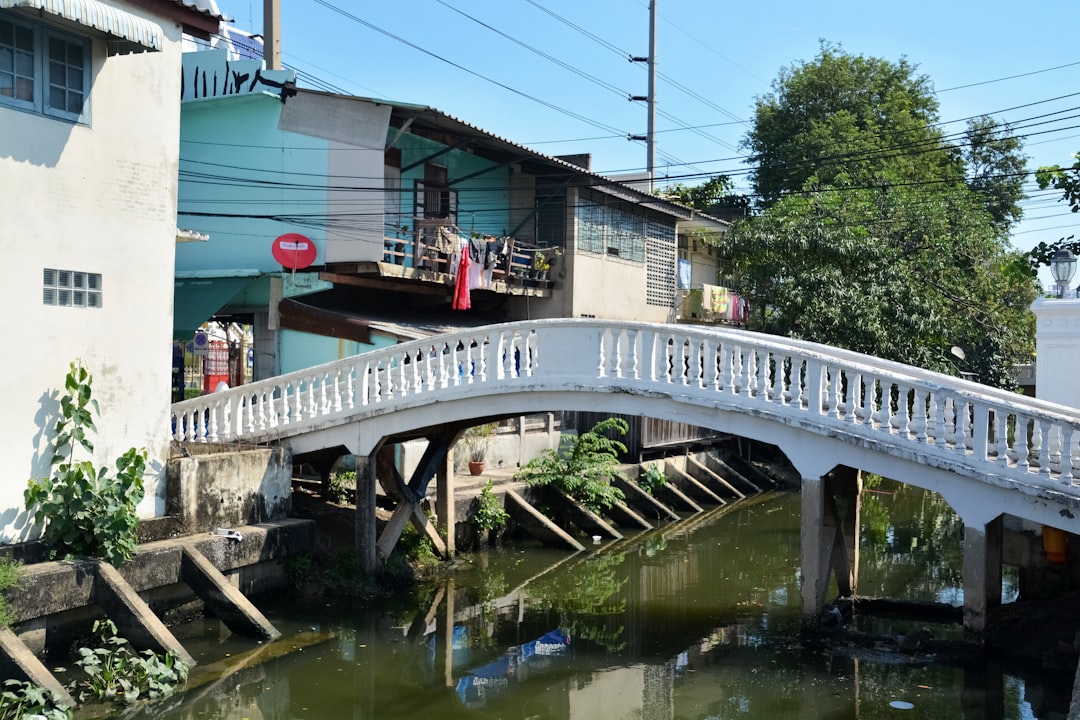 white concrete bridge over river during daytime