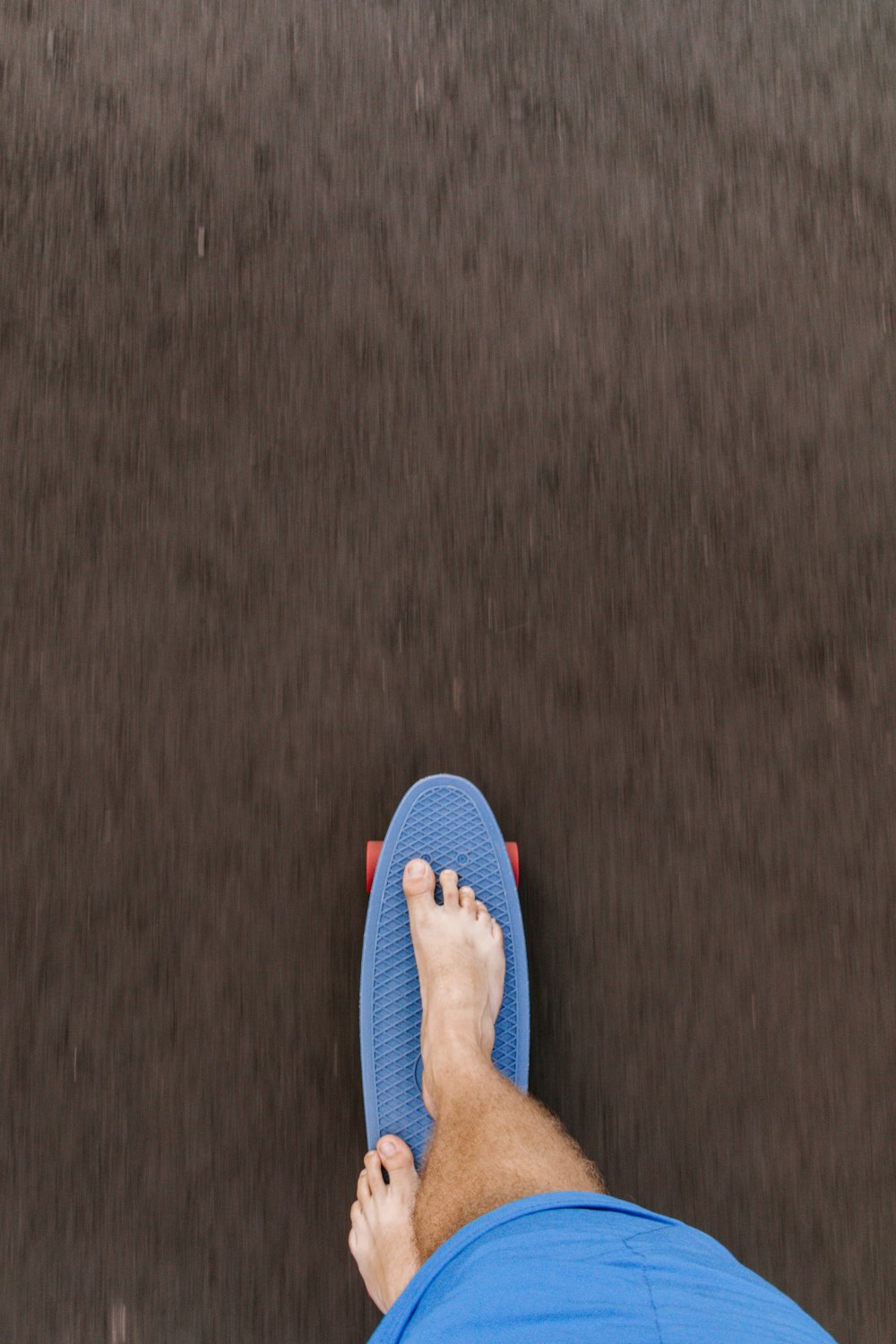 blue flip flop on brown carpet