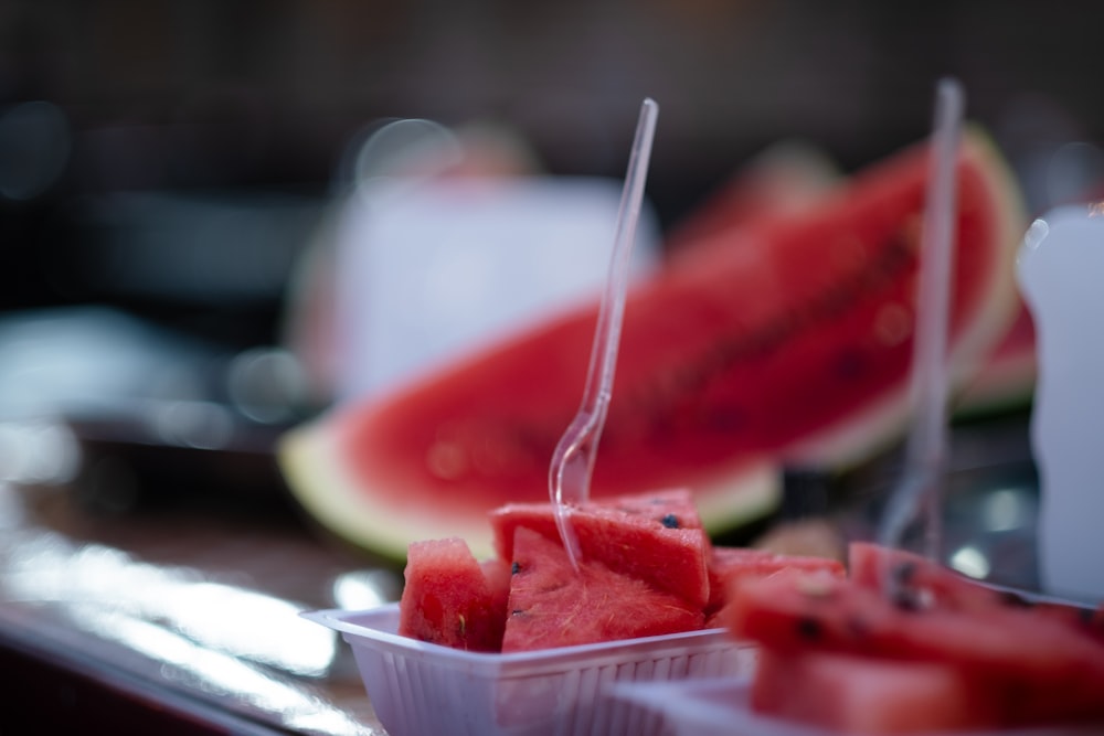 sliced watermelon on white ceramic bowl