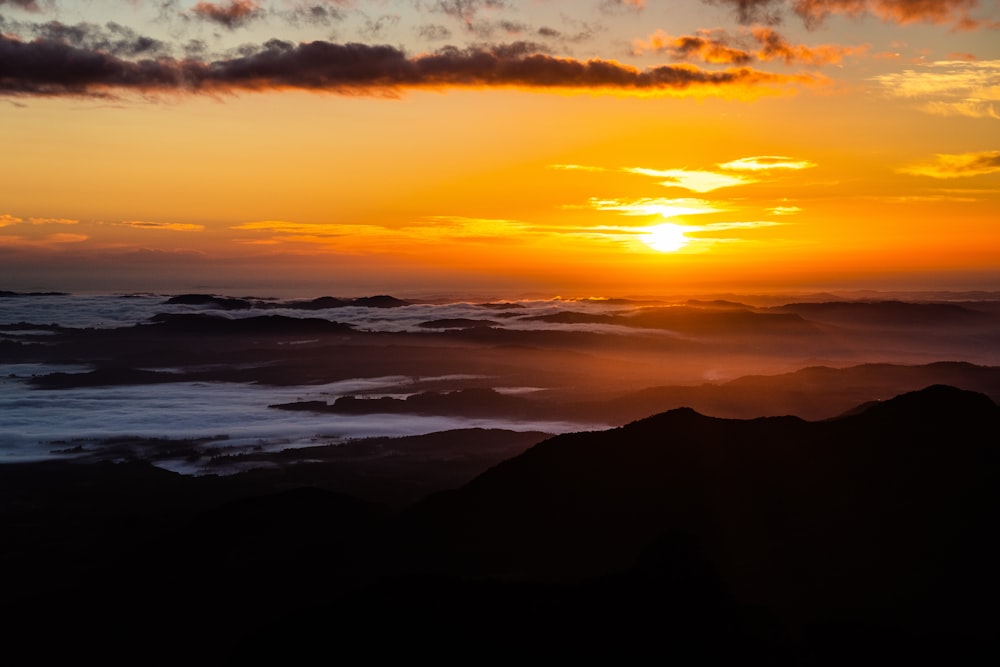 silhouette of mountains during sunset