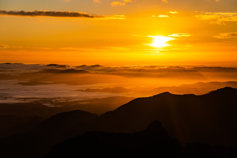 silhouette of mountains during sunset