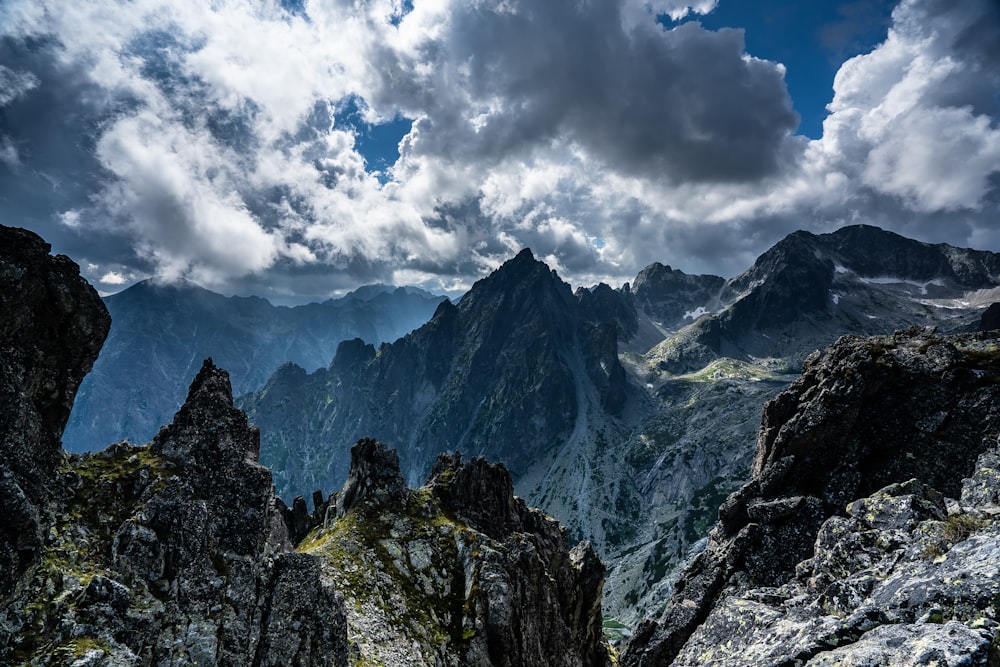 green and brown mountain under white clouds during daytime