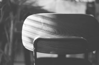 grayscale photo of wooden chair