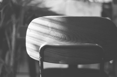 grayscale photo of wooden chair