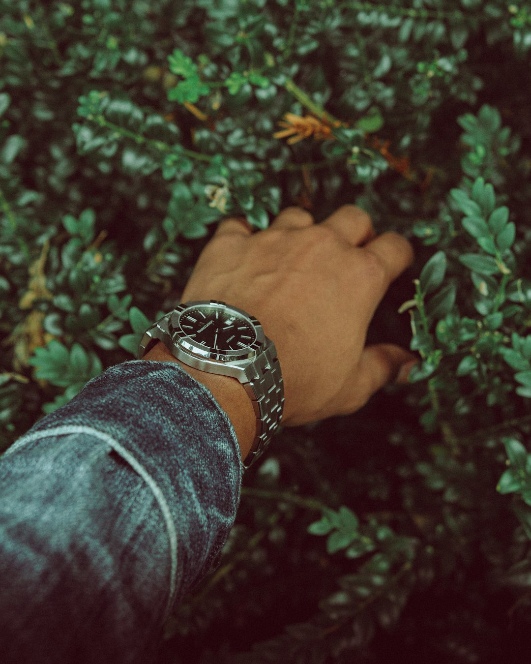 person wearing silver and black bracelet