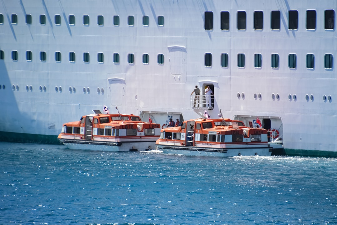 white and red ship on sea during daytime