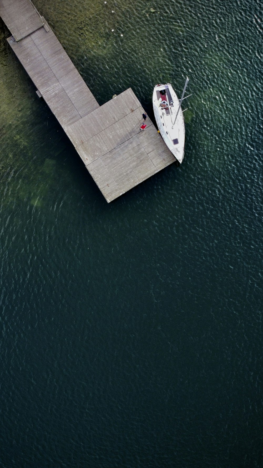 white boat on body of water during daytime