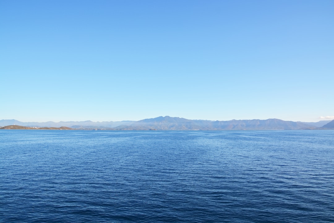 blue sea under blue sky during daytime