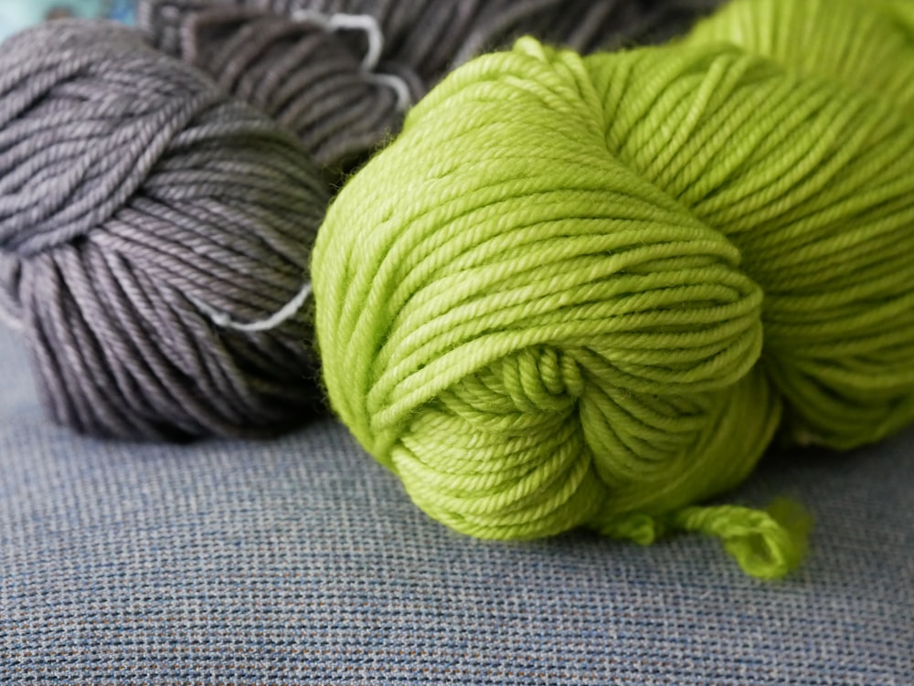 green yarn on blue textile
