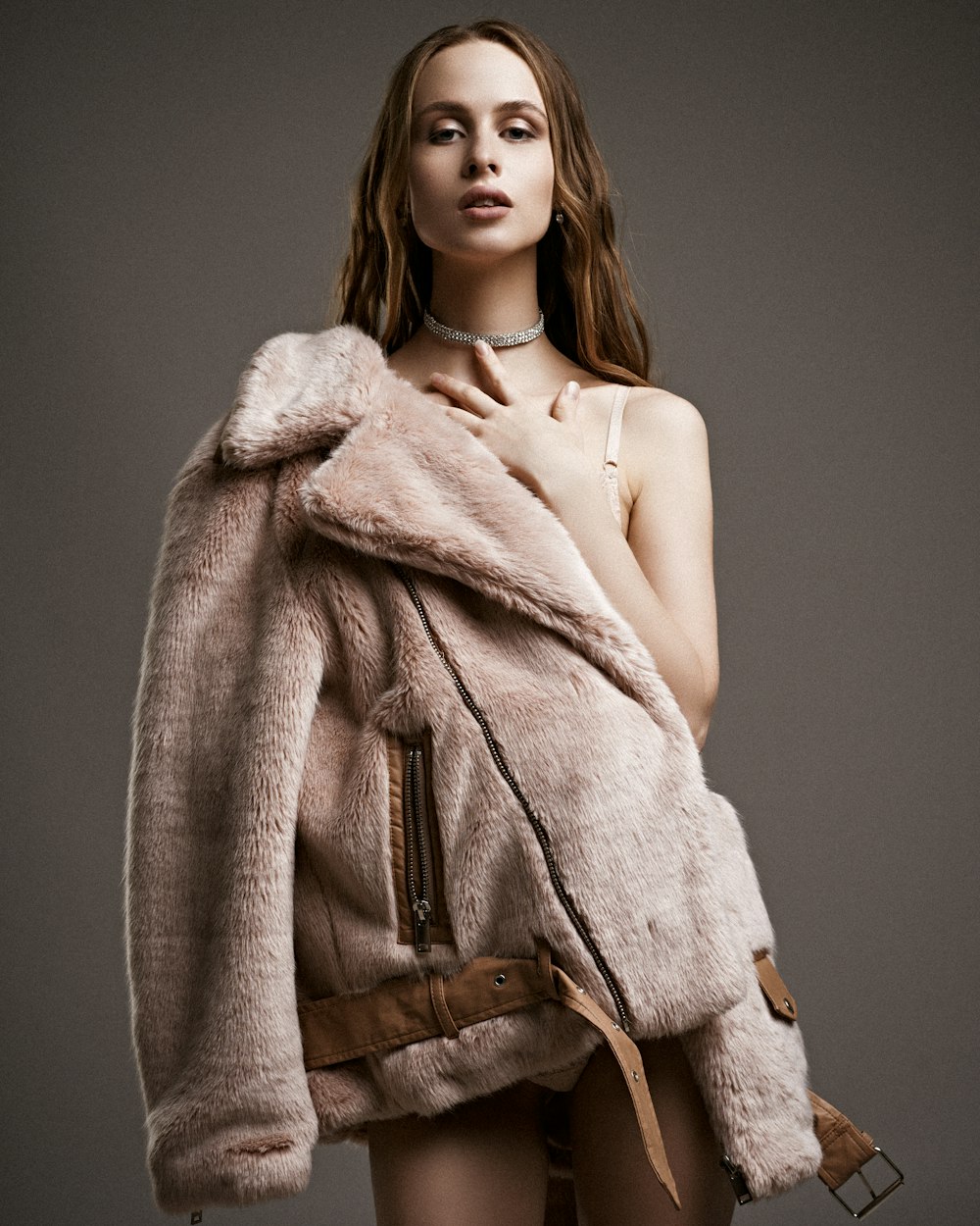 topless woman in brown coat