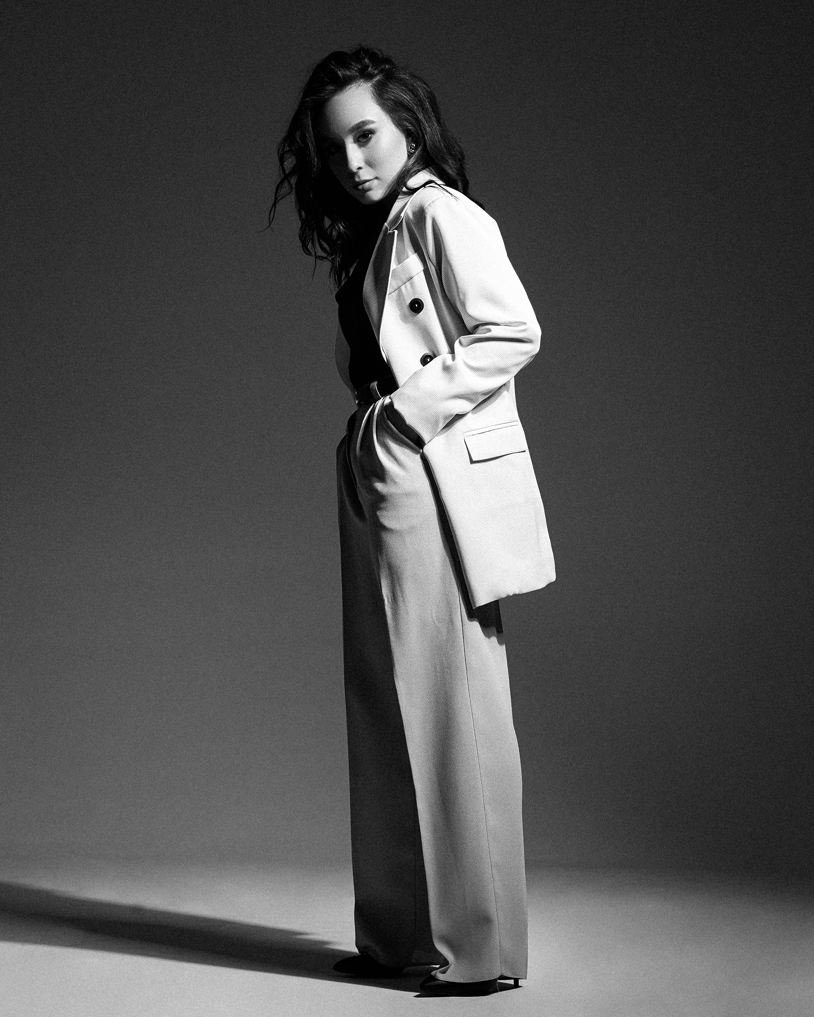 woman in white coat standing