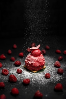 strawberry cake on black table