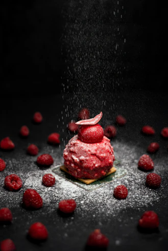 strawberry cake on black table