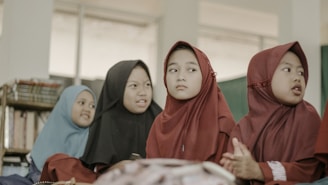 2 women in red hijab