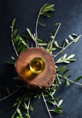 brown round wooden ornament on green leaves