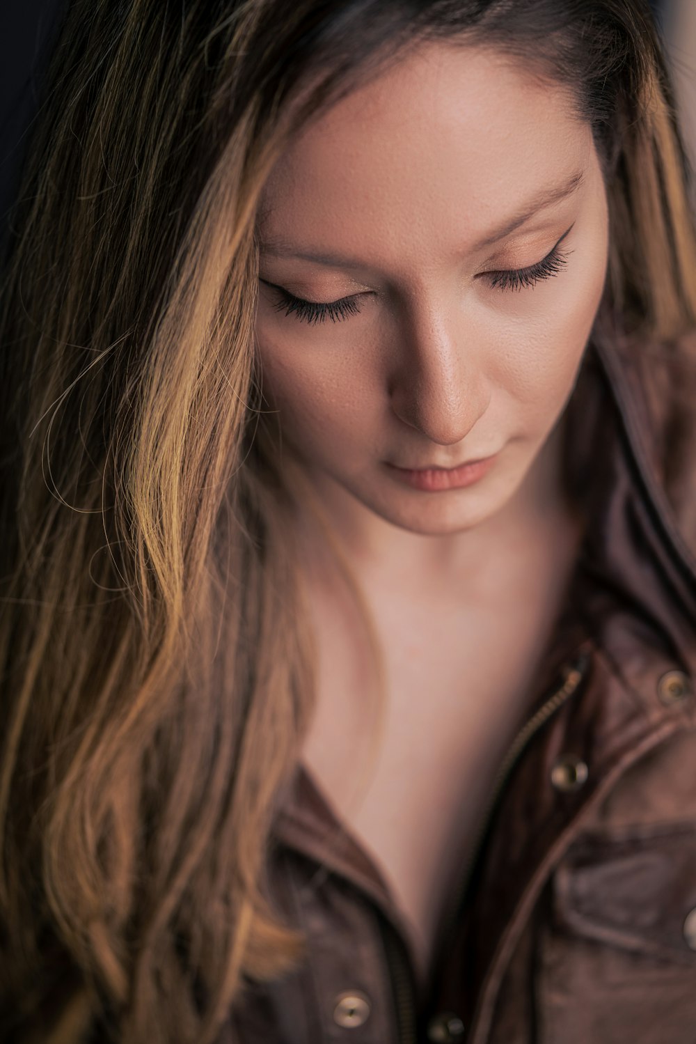 woman in black and brown jacket