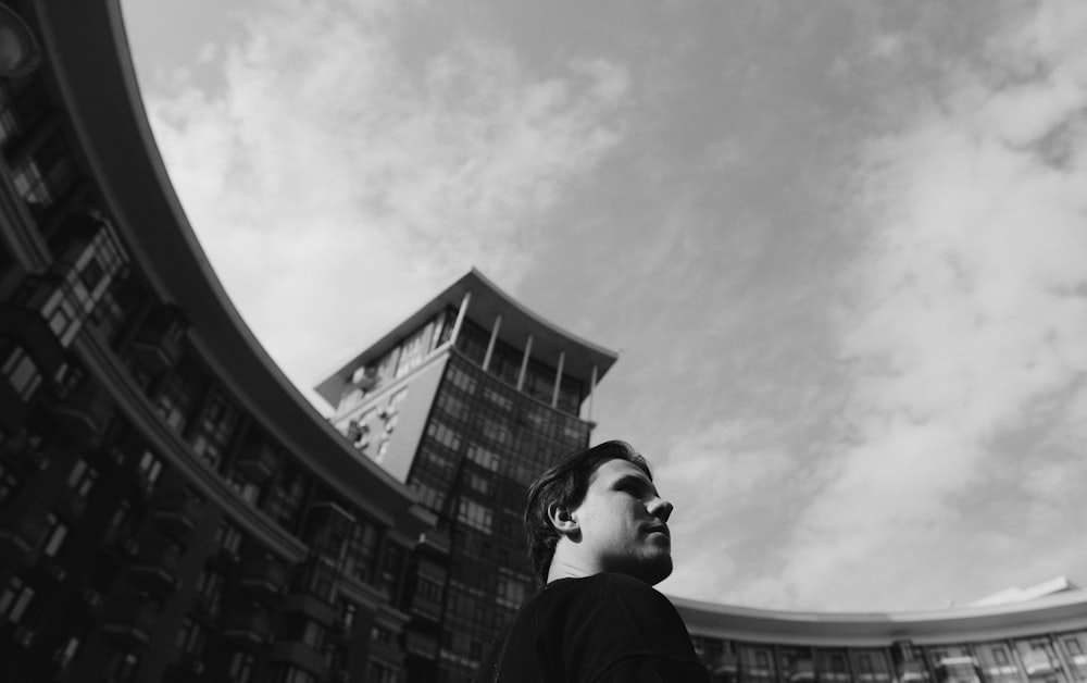 grayscale photo of man in black jacket and black sunglasses